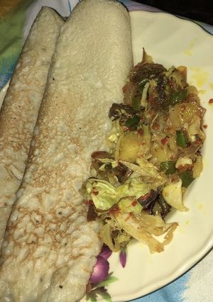 A picture of Pancakes and shredded beef sauce.