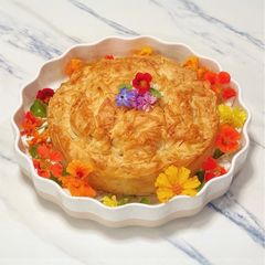 A picture of Broccoli, leek and ricotta pie.