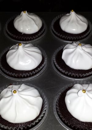 A picture of dark chocolate cupcakes w/ marshmallow frosting! yummmy :)).