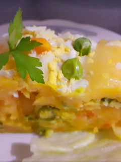 Una foto de Enrollado de causa rellena de verduras