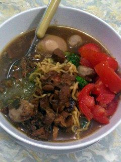 A picture of Chicken Noodles with Eggs and Meatball.