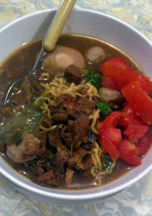 A picture of Chicken Noodles with Eggs and Meatball.