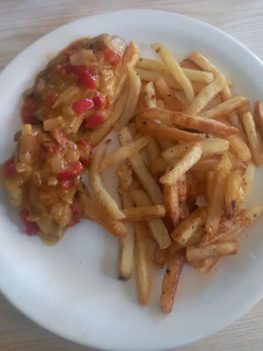 Una foto de Carre de Cerdo a la mostaza con Papas Fritas
