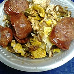 A picture of Spicy eggs, with sausage.