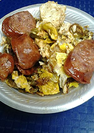 A picture of Spicy eggs, with sausage.
