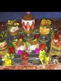 Kunafa and Qashtalia Decorated with Oranges, Strawberries, and Bananas