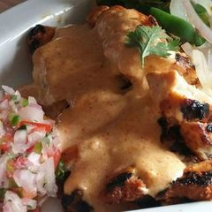 A picture of Chicken Fajita with cayeene pepper sauce.