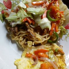 Cabbage plated noodles with veggies and egg A picture of Cabbage plated noodles with veggies and egg.