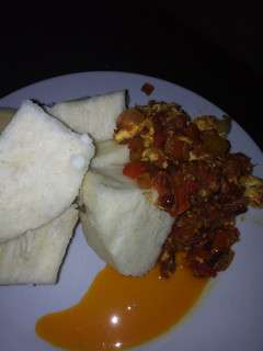 A picture of Boiled yams with eggs sauce.