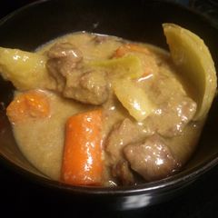 A picture of Beef stew with gravy.