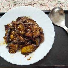 A picture of Masala Brinjal with sesame seeds.