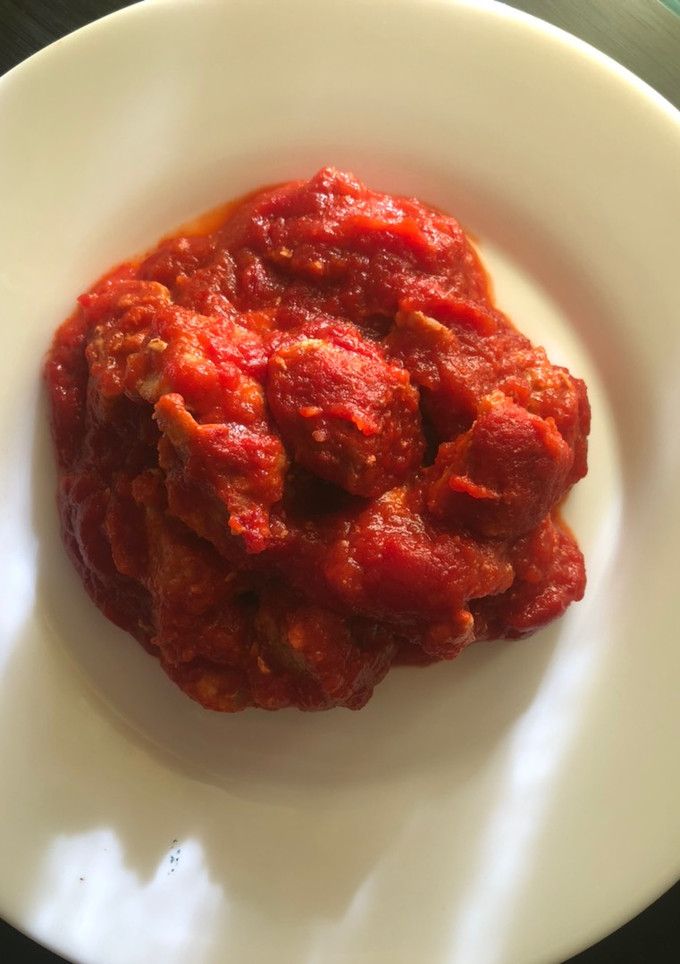 Una foto de Magra de cerdo con tomate