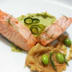 A picture of Confit Salmon with Edamame Gazpacho and Cucumber Sunomono.