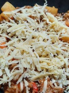 Una foto de Guiso de arroz y lentejas en disco de arado