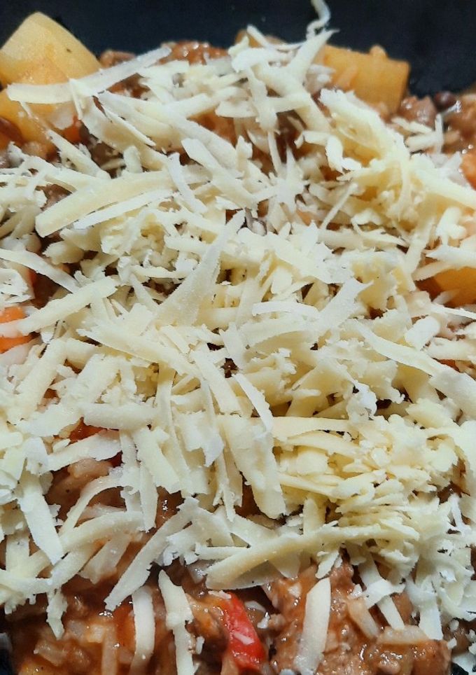 Una foto de Guiso de arroz y lentejas en disco de arado
