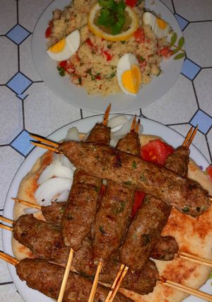 A picture of Koftas with Tabbouleh.