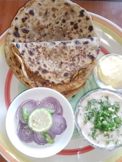 A picture of Stuffed white radish paratha (Punjabi mooli da paratha) 🧅🧄.