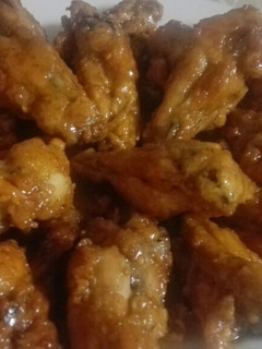 A picture of Chicken wings with caramel sauce.