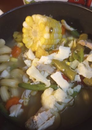 A picture of One Whole Chicken in a Soup over Noodles.
