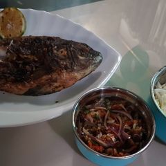A picture of BBQ Grilled fish with pepper sauce.