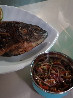 A picture of BBQ Grilled fish with pepper sauce.