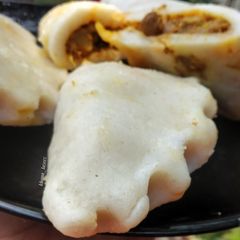 A picture of STEAMED RICE FLOUR PITHA with CHICKEN MINCE.