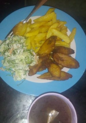 A picture of Fried irish,plantain and salad.