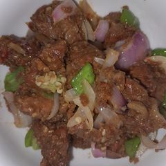 A picture of Gas meat with groundnut cookie/peanut bars(kuli-kuli) powder.