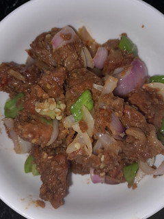 A picture of Gas meat with groundnut cookie/peanut bars(kuli-kuli) powder.