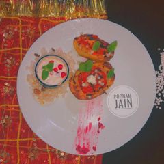 A picture of JACKET POTATOES STUFFED WITH SAGO And TOMATO CONCASSE.