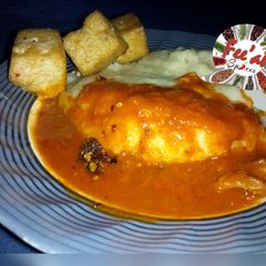A picture of Semolina wv Yoruba peppered stew.