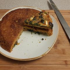 A picture of Spinach, potato and feta "tortilla" with a fried egg.
