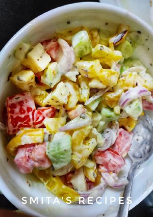 A picture of Greek salad with ranch dressing.