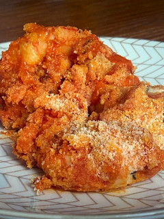 Una foto de Langostinos con tomate y jengibre