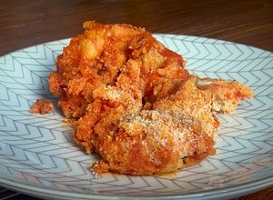 Una foto de Langostinos con tomate y jengibre