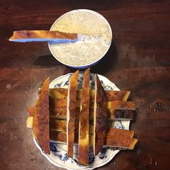 A picture of California Farm Pita Breadsticks in Tzaziki Dip.