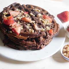 A picture of Chocolate Waffle with strawberries and walnut.