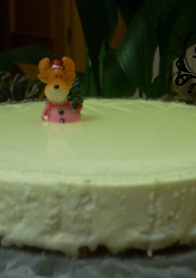 Una foto de Tarta de queso con licor de manzana y base crujiente