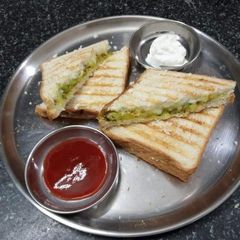 Cheesy Grilled Sandwich stuffed with leftover Aaloo Sabzi A picture of Cheesy Grilled Sandwich stuffed with leftover Aaloo Sabzi.