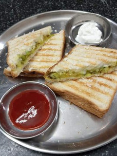 A picture of Cheesy Grilled Sandwich stuffed with leftover Aaloo Sabzi.