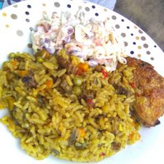 A picture of Carribean Rice pair wit Salad and oven baked Honey glazed chic.