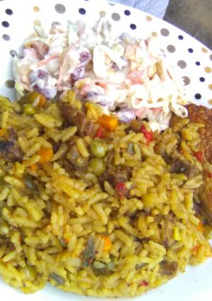 A picture of Carribean Rice pair wit Salad and oven baked Honey glazed chic.