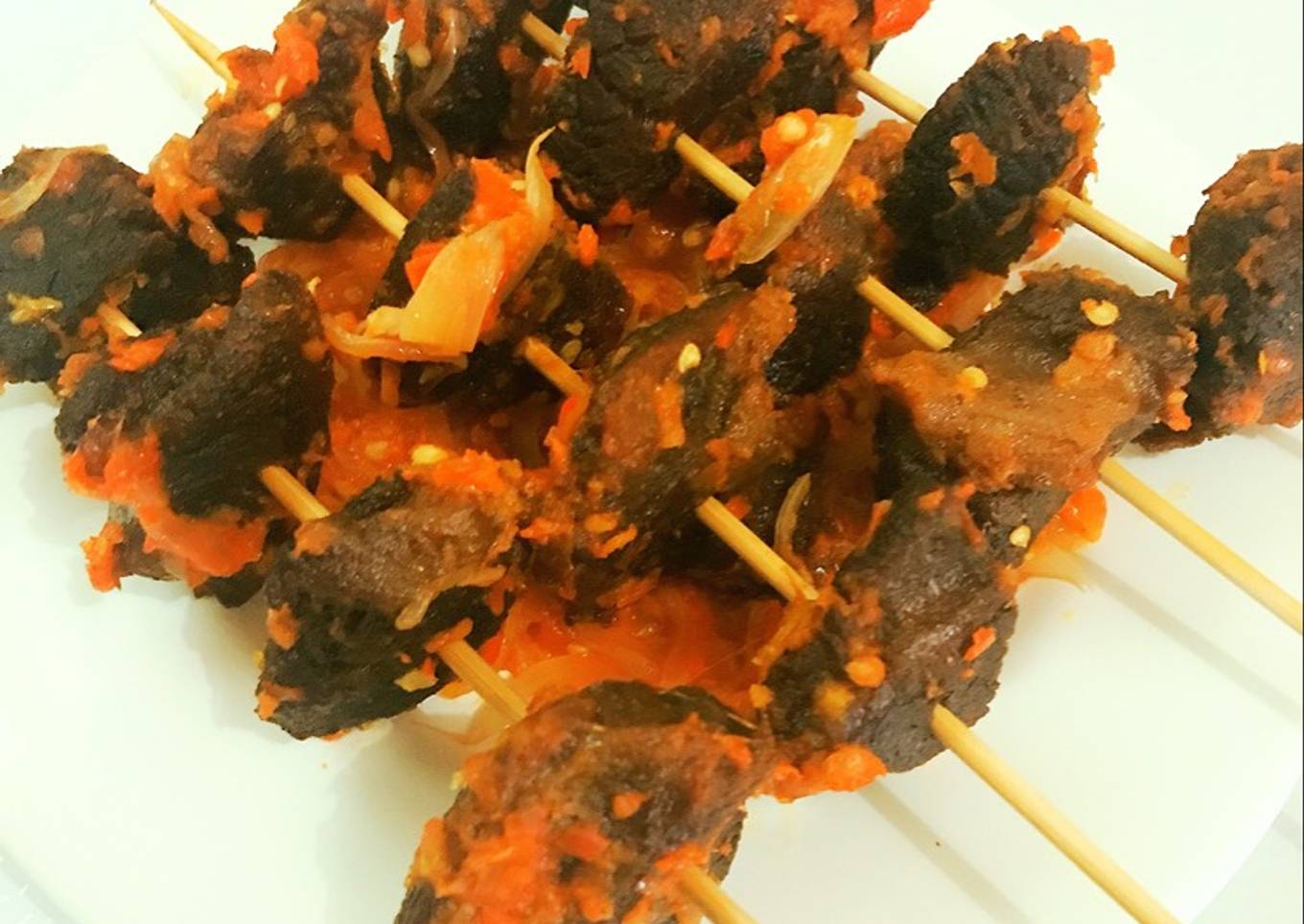 Peppered fried beef on skewer