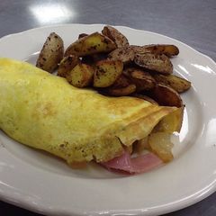 A picture of One egg omelette with home fries for one.