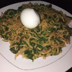 A picture of Leafy greens veggie noodles with egg.