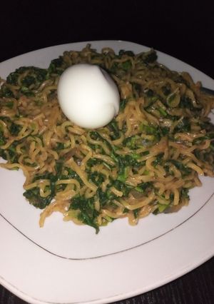 A picture of Leafy greens veggie noodles with egg.