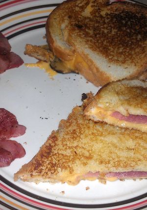A picture of grilled cheese with Bacon.