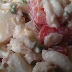 A picture of Potato salad with tomatoes.