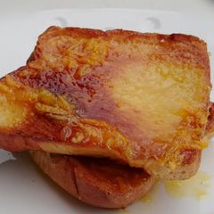 A picture of Bread With Orange Icing.