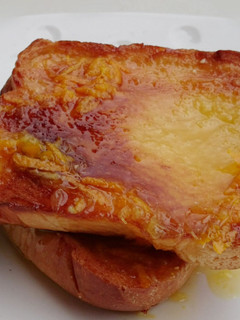 A picture of Bread With Orange Icing.